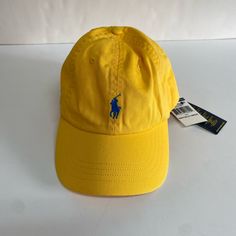 -Brand New With Tags -100% Cotton, Eyelet Vents, Adjustable Strap, Logo Embroidered - Color: Yellow . One Size Yellow Cotton Dad Hat For Spring, Yellow Casual Dad Hat For Spring, Casual Yellow Dad Hat For Spring, Casual Yellow Baseball Cap For Spring, Yellow Casual Baseball Cap With Short Brim, Yellow Cotton Dad Hat With Curved Brim, Yellow Cotton Curved Brim Dad Hat, Casual Yellow Cotton Dad Hat, Casual Yellow Dad Hat