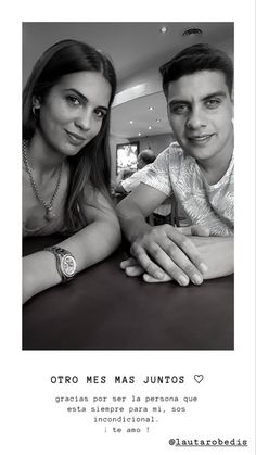 a man and woman sitting next to each other in front of a poster with the words otro mes mas junoos