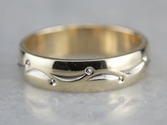 So lovely! This vintage piece is in the cigar band style, with a dotted lined pattern wrapping the ring, worn alone or against an engagement piece, this piece is sweet and timeless! Metal: 14K Yellow and White Gold Width of Band: 4.3 mm Height off Finger: 1.4 mm Ring Size: 4.50 Marks: "ARTCARVED{14KT" Stamped on the inside band Heirloom Anniversary Band With Polished Finish, Elegant Engraved Ring With Thick Decorative Band, 14k Gold Promise Band With Decorative Detail, Heirloom Diamond Ring With Decorative Band For Formal Occasions, Modern Decorative Band As Gift, Anniversary Yellow Gold Band With Decorative Detail, Modern Decorative Bands As Gifts, Anniversary Yellow Gold Decorative Band, Anniversary Engraved Band Ring