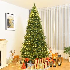 a decorated christmas tree with presents under it