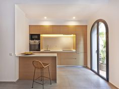 a kitchen with an island and bar stools