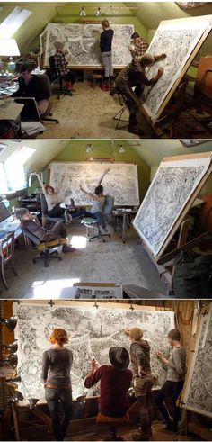 people are working on drawings in an art studio