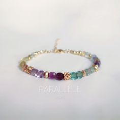 ★Multicolor Fluorite bracelet and 14k gold filled pearl★ ------------------------------------------------ ♢COLLECTION Nebula ♢ Description All materials and stones used in jewelry are carefully selected, high quality natural stones of A 2A 3A and gem quality are used, jewelry design is only created by owner of PARALLÈLE PARIS. You can combine with other bracelets or just wear it alone ♢Fluorite in Lithotherapy ✨Multi-colored fluorite has been a beautiful stone that has been prized for centuries due to its spiritual qualities. The fluorite stone is considered a symbol of mental clarity and focus ♢ Symbolic of Fluorite Mental clarity and focus Stimulate the mind ♢Details This bracelet is composed of 4mm multicolored cubic Fluorite beads faceted cut, and 14k gold filled beads 💎 Fluorite bead Fluorite Bracelet, Paris Jewelry, Fluorite Stone, Bracelet Christmas, Rose Quartz Bracelet, Elegant Bracelet, Minimalist Bracelet, Pretty Bracelets, Original Jewelry