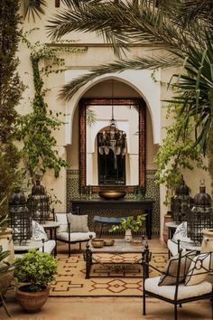 a living room with lots of furniture and plants