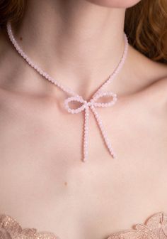 This blush pink beaded bow necklace is an intricately handmade piece of jewelry that goes well with everything. They can easily be dressed up or down for casual and formal/going-out looks, making a great everyday necklace that is still eye-catching and unique. A great amount of care, passion, and attention to detail goes into every step of its creation, making it a truly high-quality and special piece of jewelry that you can feel good about wearing for years to come. This makes the perfect gift Beaded Bow Necklace, Beaded Bow, Motifs Perler, Beaded Necklace Diy, Handmade Jewelry Tutorials, Bow Necklace, Jewelry Accessories Ideas, Pink Jewelry, Pink Necklace