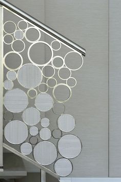 a metal stair case with circles on it