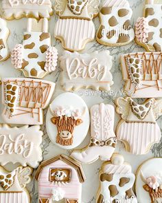 decorated cookies are displayed on a table