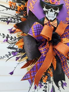 a wreath with a skeleton wearing a top hat