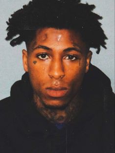 a man with dreadlocks on his head is shown in this mugshot photo