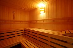 a wooden sauna with two benches in it