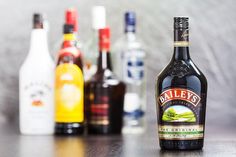 bottles of alcohol are lined up on a table