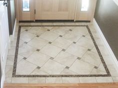 a tile floor in the entry way of a house