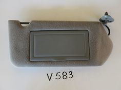 an electronic device is displayed on a white surface with the number v583 below it