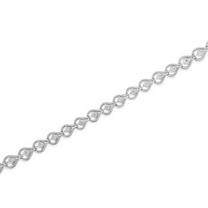 Elegant and timeless, this gorgeous sterling silver link bracelet features 0.29 carat total weight of round, promo quality diamonds in our unique miracle-plate setting, which centers each genuine diamond in a mirror-finish, high-polish frame that gives the illusion of a much larger stone. Promo quality diamonds are on the lowest of diamond color and quality scale and are milky and cloudy in nature. The tennis bracelet features open teardrop shaped links with diamonds in the center. The 7” bracel Bracelet Tennis, Silver Link Bracelet, Jewelry Essentials, Bracelet Collection, Pendant Bracelet, Tennis Bracelet, Quality Diamonds, Silver Diamonds, Eternity Ring