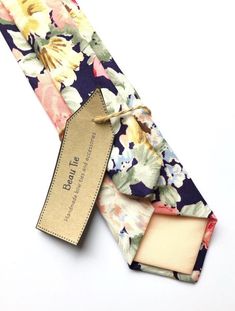 IMPORTANT SHIPPING INFO: Any orders made between Sat 27th July - Weds 7th August will not be shipped until after these dates due to holiday. Please get in touch if you have any further questions, I will be available to answer messages.DESCRIPTION: This lovely men's skinny tie has been handmade using a vintage navy/indigo cotton with a pink, yellow and blue rose print. FABRIC: Vintage Rose & Hubble cotton.LINING FABRIC: Cotton.------------------------------------------------------------------ Summer Pocket Square For Suit And Tie As Gift, Summer Floral Print Suit And Tie Accessories For Gift, Summer Floral Print Suit And Tie Accessories, Summer Gift Pocket Square For Suit And Tie, Summer Gift Pocket Square Suit Accessories, Floral Print Standard Tie For Gift, Men’s Floral Tie Wedding, Floral Print Standard Tie For Wedding, Elegant Patterned Tie With Floral Print