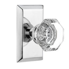 an image of a glass door handle with crystal knobs on the front and side