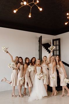 a group of bridesmaids posing for a photo