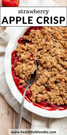 a close up of a plate of food with strawberries and crumbled topping