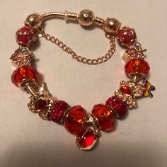 Red & Gold Pandora Bracelet With Lots Of Charms. Also Come With Bag, Cleaning Cloth And Instructions On How To Care For Bracelet. Brand New Never Worn. Gold Pandora Bracelet, Gold Pandora, Pandora Red, Pandora Bracelet, Pandora Jewelry, Cleaning Cloth, Womens Jewelry Bracelets, Red Gold, Charms