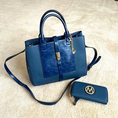 Brand New Navy Blue Purse With Gold Accents And Matching Wallet. Comes With Keychain, Cross Body Strap. Cheap Blue Women's Wristlet, Navy Blue Purse, Navy Purse, Blue Purse, Gold Accents, Cross Body, Crossbody Bags, Bag Lady, Navy Blue