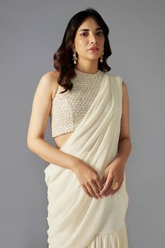 Ivory mermaid pre-draped saree in a solid base with tiers. Comes with padded blouse embellished by sequin and bead scallop patterns. - Aza Fashions Elegant Blouse With Pearl Embroidery And Traditional Drape, Elegant Fitted Pre-draped Saree With Pearl Embroidery, Elegant Sleeveless Blouse With Pearl Embroidery, Elegant Pre-draped Saree With Pearl Embroidery For Evening, Elegant Pre-draped Saree With Pearl Embroidery, Elegant White Pre-draped Saree With Pearl Embroidery, Elegant White Pearl Embroidered Pre-draped Saree, Elegant Evening Pre-draped Saree With Pearl Embroidery, Sleeveless White Blouse For Reception