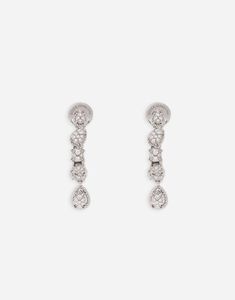 A drop-shaped diamonds hang down at the end and a small DG logo appears and disappears discreetly. Technical specifications: 18kt white gold; Gemstones: n. 74 diamonds, 0.50 ct approximately; VVS-VS; colour: D-G; Made in Italy. Dolce And Gabbana Earrings, Woman Earrings, Earrings White Gold, Pave Jewelry, Dg Logo, Earrings In Gold, Diamond Drop Earrings, Watches Jewelry, Diamond Earrings Studs