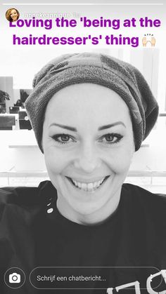 a smiling woman wearing a turban on her head with the caption saying loving the being at the hairdresser's thing