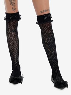 Spice up your look with these black  crochet over-the-knee socks! The come with cuff detailing at the top and dainty satin bow accents.NylonHand wash cold; drip dryImported Fitted Black Socks With Lace Trim, Black Socks With Lace Trim For Spring, Stretch Black Stockings With Lace Trim, Party Black Legwear With Lace Trim, Black Lace Trim Legwear For Party, Black Party Legwear With Lace Trim, Black Lace Thigh-high Stockings, Black Thigh High Legwear With Lace Trim, Black Lace Socks With Lace Trim