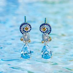 Sparkling and stunning, these earrings will capture your heart at first sight. A combination of light blue, midnight blue, yellow gold and white stones, each eye-catching earring features a premium miniature version of Van Gogh's timeless Starry Night painting and a pear cut stone. This piece of work reminds us to trust our dreams and not believe the critics of the world. "There is always hope, even in the darkest of times." So trust your dream and let this alluring jewelry make a statement.Cara Luxury Blue Pierced Earrings, Blue Diamond Earrings With Sparkling Stones, Luxury Blue Topaz Blue Earrings, Blue Luxury Earrings With Gemstone Accents, Blue Diamond Drop Earrings, Blue Diamond Pierced Earrings, Exquisite Blue Earrings, Exquisite Blue Gemstone Earrings, Blue Gemstone Drop Earrings