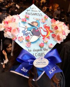 a woman wearing a graduation cap with flowers on it