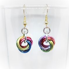 "A darling pair of shiny twist earrings.  Earrings are about 1\" long and made from anodized aluminum rings, which are extremely lightweight and very strong.  Plus, anodized aluminum won't tarnish or rust, it's colorfast, will stay vibrant and shiny for years, and cleans up in simple dish soap (non-lotion) and water.   All earrings are packaged in an attractive silver gift box - perfect for gift giving." Hypoallergenic Rainbow Colored Metal Jewelry, Hypoallergenic Rainbow Metal Jewelry, Rainbow Metal Earrings With Ear Wire, Rainbow Metal Earrings, Twist Earrings, Scale Mail, Cardboard Jewelry Boxes, Silver Gift Box, Color Scale