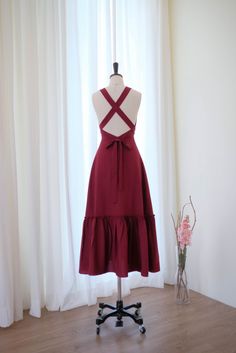 "New arrival Marilyn cross back party midi dress The dress comes with long straps to self cross around back and waist Back zipper Deep v neck Lined Patched skirt Midi length Size chart XS : Bust 33\" Waist 24\" Hips free Length 48\" S : Bust 35\" Waist 26\" Hips free Length 48\" M : Bust 37\" Waist 28\" Hips free Length 48\" L : Bust 39\" Waist 30\" Hips free Length 48\" XL : Bust 41\" Waist 32\" Hips free Length 48\" Materials : Polyester , Lining We do not accept return , Refund or exchange in Patched Skirt, Bridesmaid Dresses Midi, Burgundy Bridesmaid Dress, Wine Bridesmaid Dresses, Halter Party Dress, Cocktail Dress Wedding Guest, Wine Dress, Vintage Party Dresses, Burgundy Bridesmaid