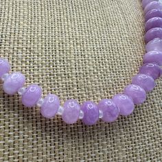 This elegant Lavender Sugar Gemstone Necklace is designed to add a touch of sophistication to any outfit. It features beautiful gemstones that exude a sense of calm and peace. Handcrafted with care, this necklace necklace commands attention, with its adjustable design perfect for layering and a vibrant pop of color to amp up any look! Gemstone Necklace, Lavender, Color Pop, Gemstones, Color