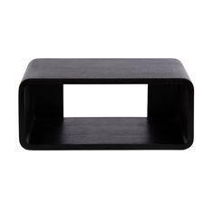 a small black shelf sitting on top of a white wall