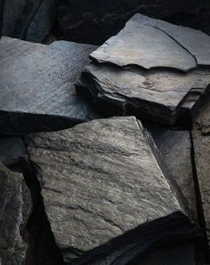 some rocks that are stacked together on the ground