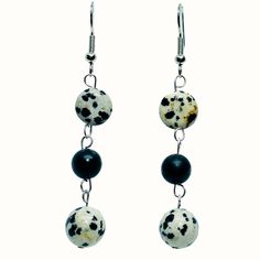 Natural Dalmatian Jasper beads and matte black Onyx gemstone dangle earrings.on stainless steel earring posts. The hang at 2.5 inches. The neutral palette of the Dalmatian Jasper earrings makes them a versatile accessory that effortlessly harmonizes with an array of colors. Whether paired with a classic little black dress for a touch of intrigue, or with a vibrant blouse to create a captivating contrast, these earrings adds a dash of artistic flair to any ensemble. Dalmatian Jasper, also known a Dalmatian Stone, Classic Little Black Dress, Dalmatian Jasper, Jasper Earrings, Druzy Earrings, Onyx Gemstone, Handmade Gift Wrap, Earring Posts, Jasper Beads