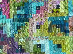 a colorful quilt with lots of different colored squares