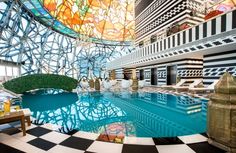 an indoor swimming pool in a large building