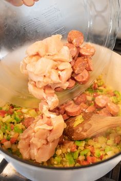 the food is being cooked in the pot on the stove top and ready to be eaten