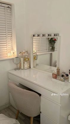 a white vanity and chair in a room