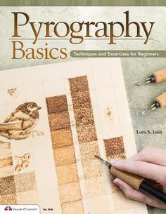 a book with an image of a hand holding a pen and writing on paper that reads pyrographicy basics