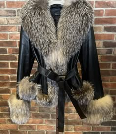 The ultimate classic jacket is this beautiful leather with grey fox fur trimming and belt. It features genuine leather and 100% genuine fox fur, and belt to cinch the waist. This runs small. Order one size up. Additional promo codes aren't applicable to this jacket. Fox Clothes, Leather Jacket With Fur, Oc Fashion, Lambskin Jacket, Fox Fur Jacket, Grey Fox, Winter Outwear, Gowns Prom