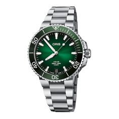 All-around function and style come together in this Aquis Date men's watch from Oris. The green dial is set in a 41mm stainless steel case surrounded by a green ceramic minutes ring, and is topped by a scratch-resistant sapphire crystal. The automatic movement is visible through the mineral case back. Water-resistant to 300 meters, the men's watch includes easy-to-read luminous hands and markers, a large crown and easy-to-grip bezel. A fold-over clasp secures the stainless steel bracelet. Style Omega Planet Ocean, Oris Aquis, Oris Watches, Bell Ross, Planet Ocean, Divers Watch, Louis Armstrong, Tommy Lee, Top Rings