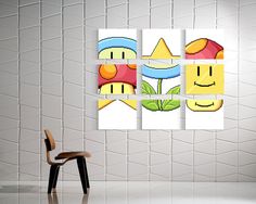 a chair sitting in front of a wall with four different pictures on it and one has a smiley face