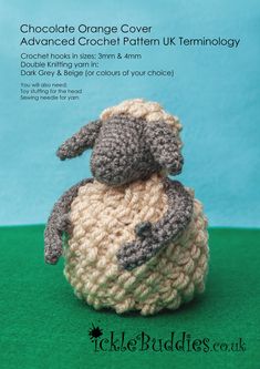 a crocheted stuffed animal sitting on top of a green surface with the words chocolate orange cover advanced crochet pattern uk technology