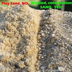 there is sand on the ground with words written below it that say play sand, wanted construction sand, yes