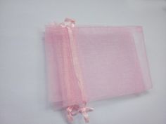 two pieces of pink tulle sitting next to each other