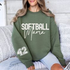 Customize your sleeve and wear this softball Mama Shirt proudly! Can be customized to say anything else as well!! Canadian buyers! Please not that I can only source the military green and sand coloured sweaters form the US so they take a little longer to arrive (20 days ) compared to approximately a week for the other colours:) SWEATER DESCRIPTION *SIZES ARE UNISEX* -I'd suggest your usual size for a more fitted look, or sizing up for a more relaxed fit. *these sweatshirts are extra comfy when o Softball Mom Sweatshirt, Casual Sweatshirt With Team Name For Team Events, Casual Long Sleeve Sublimation Design With Team Name, Game Day Green Sweatshirt With Team Spirit, Green Casual Tops For Team Events, Casual Green Top For Team Events, Sporty Customizable Tops With Relaxed Fit, Casual Sublimation T-shirt With Letter Print For Team Events, Casual Tops For Football Season Team Events