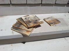 several pieces of wood sitting on top of a bench