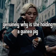 a woman talking on a cell phone while holding a donut in one hand and texting, gennuly why is she holding a guinea pig?